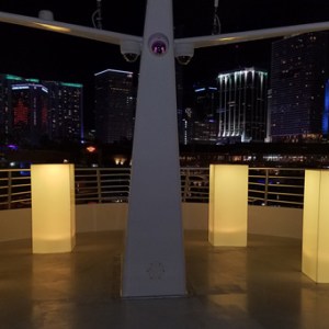 Yacht deck at night with city in bachground