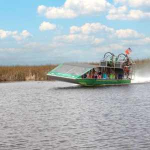 Private airboat gliding through Miami Everglades Park